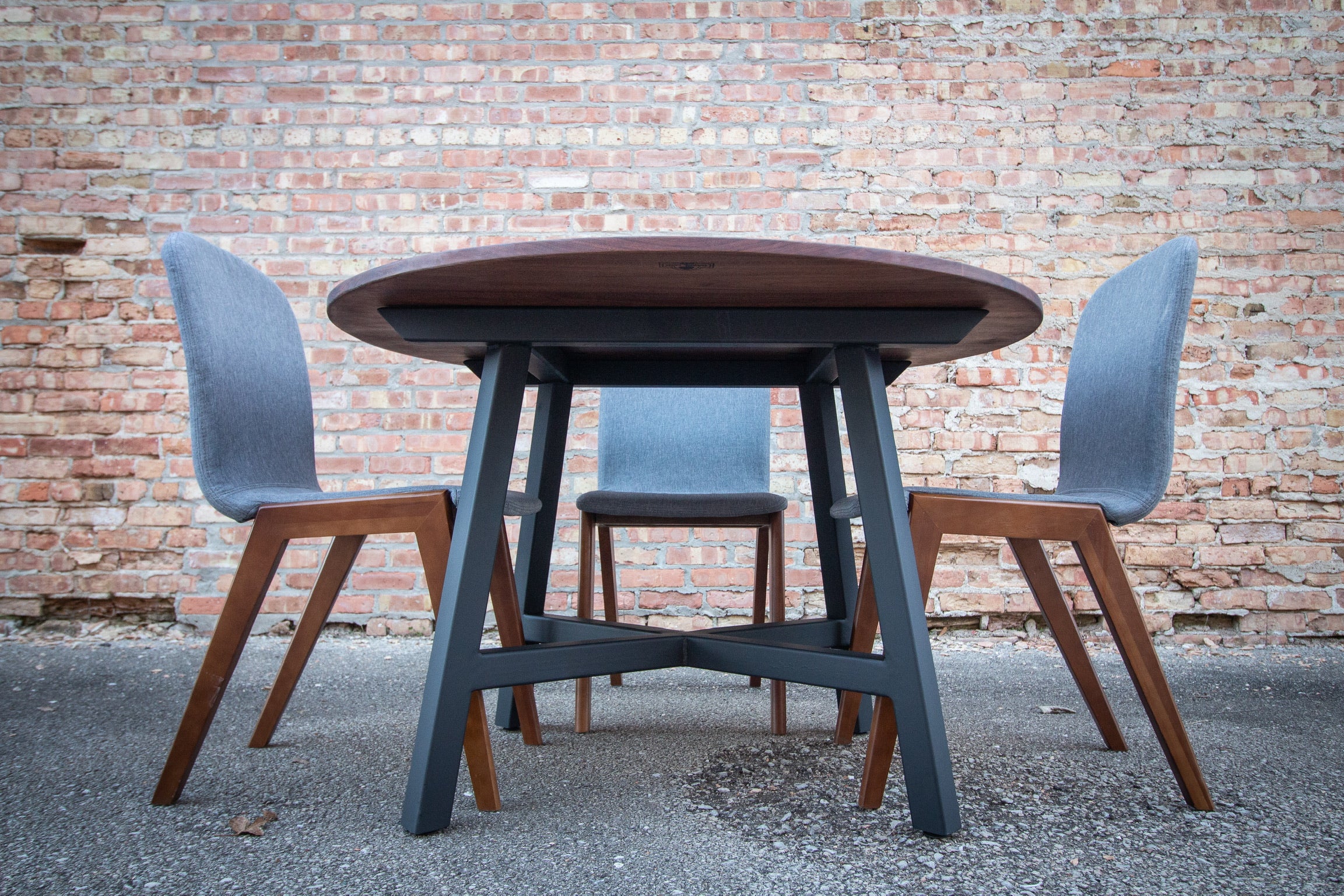 Modern Round Walnut Dining Table with Black Steel Legs