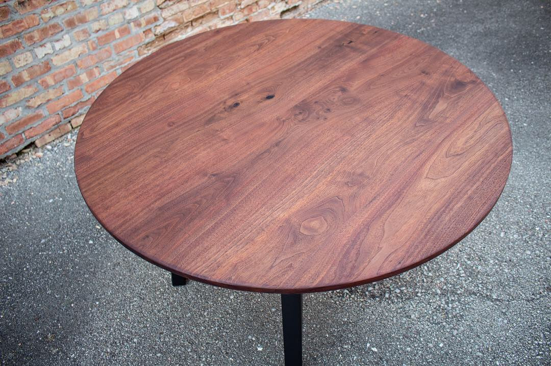 Modern Round Walnut Dining Table with Black Steel Legs
