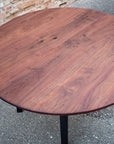 Modern Round Walnut Dining Table with Black Steel Legs